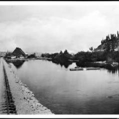 View of the Truckee River near Lake Tahoe, showing locomotive tracks, ca.1900