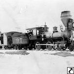 U&N Ry #97 at Eagle Rock, 1885. Note the Utah & Eastern Way Car in tow.