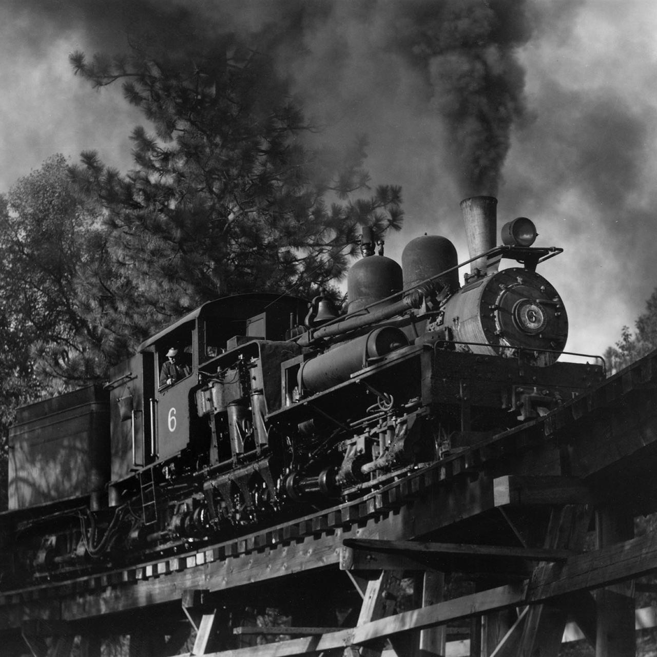 #6 on a low trestle, headed towards the woods in 1952.