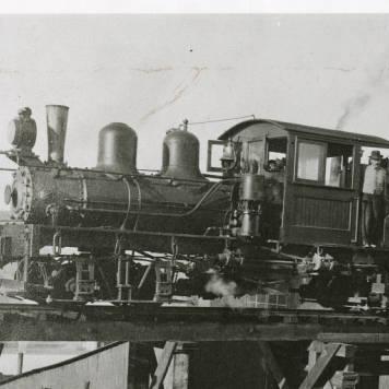 Shay with ore cars on trestle at the mill in Goodsprings.