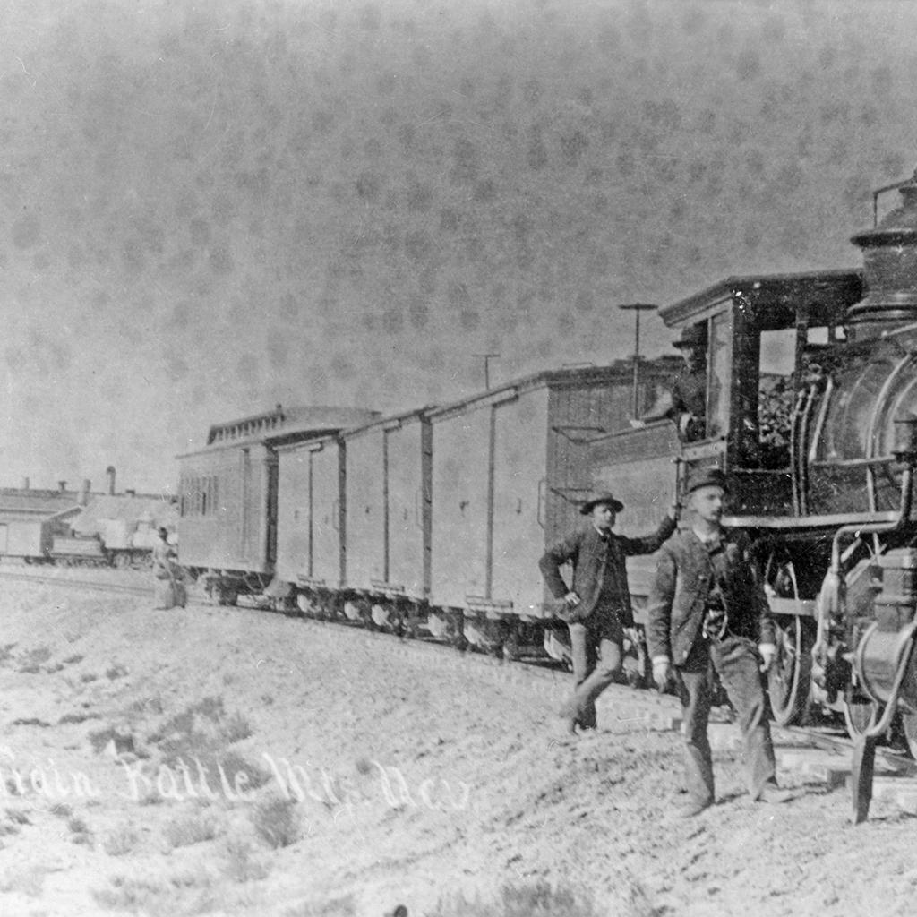 #1 and crew pose with their train at Battle Mountain, circa 1887.