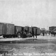 Transferring mail from narrow gauge train on the ice at Nenana.