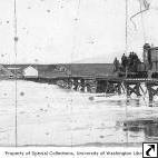 Locomotive on trestle crossing a river, location unknown, n.d.