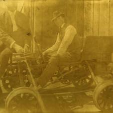 Two men seated on Buda inspection car circa 1902.